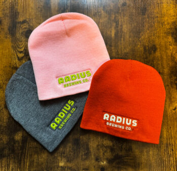 Radius branded beanies in the colors Pink, Heather Grey and Orange